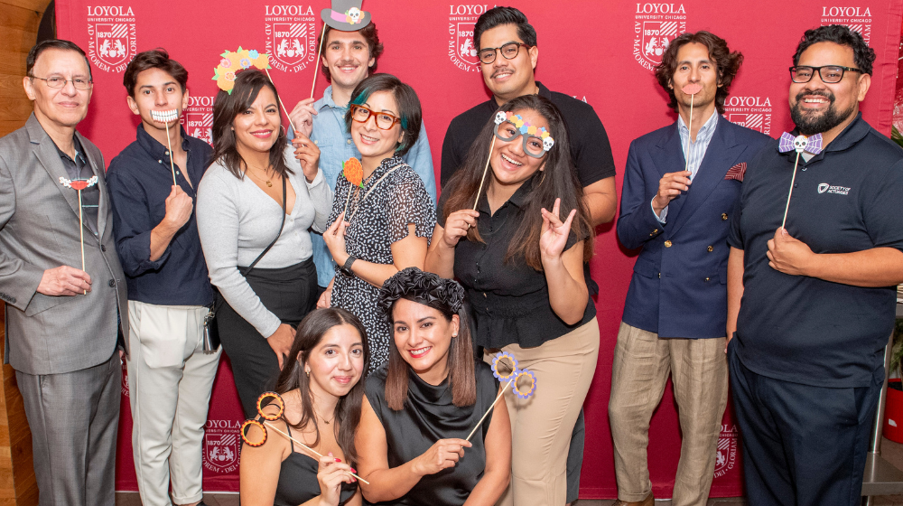 Members of Loyola University Latino Alumni Board (LULAB) Affinity Network pose for a picture at an event sponsored by their board.
